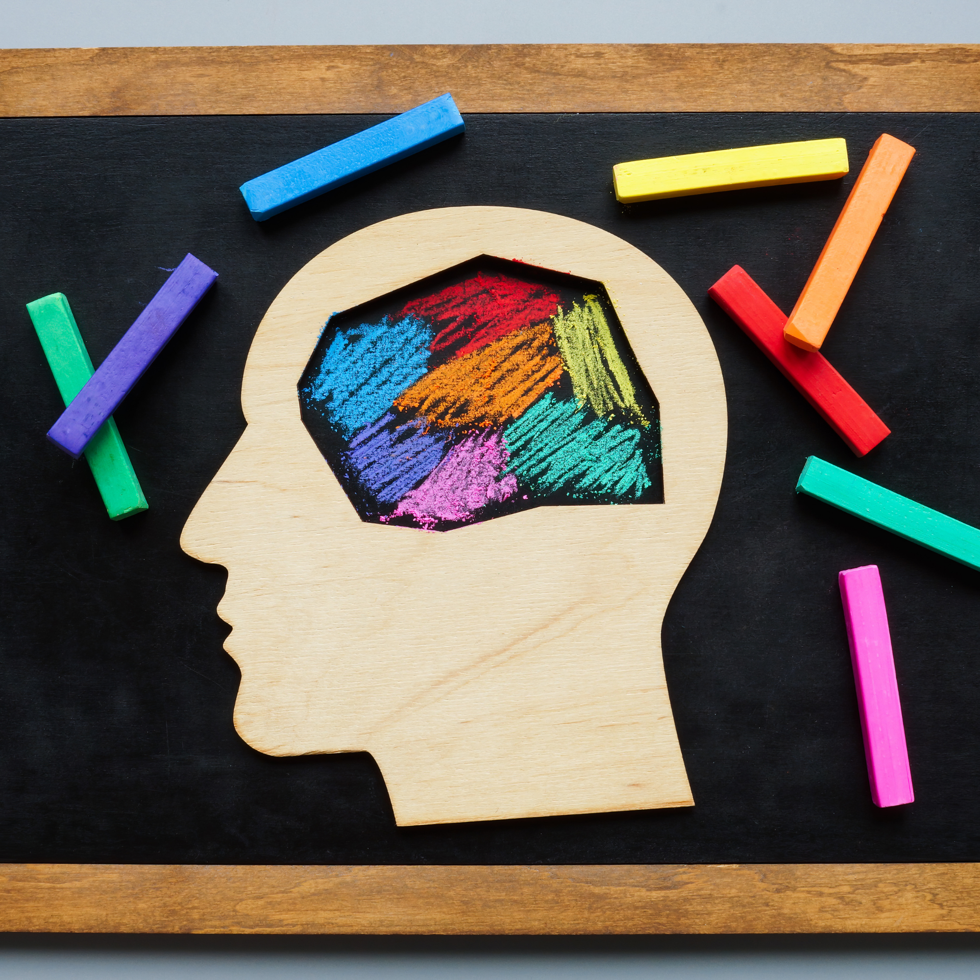 Child reading with illustrated question marks and a lightbulb idea graphic